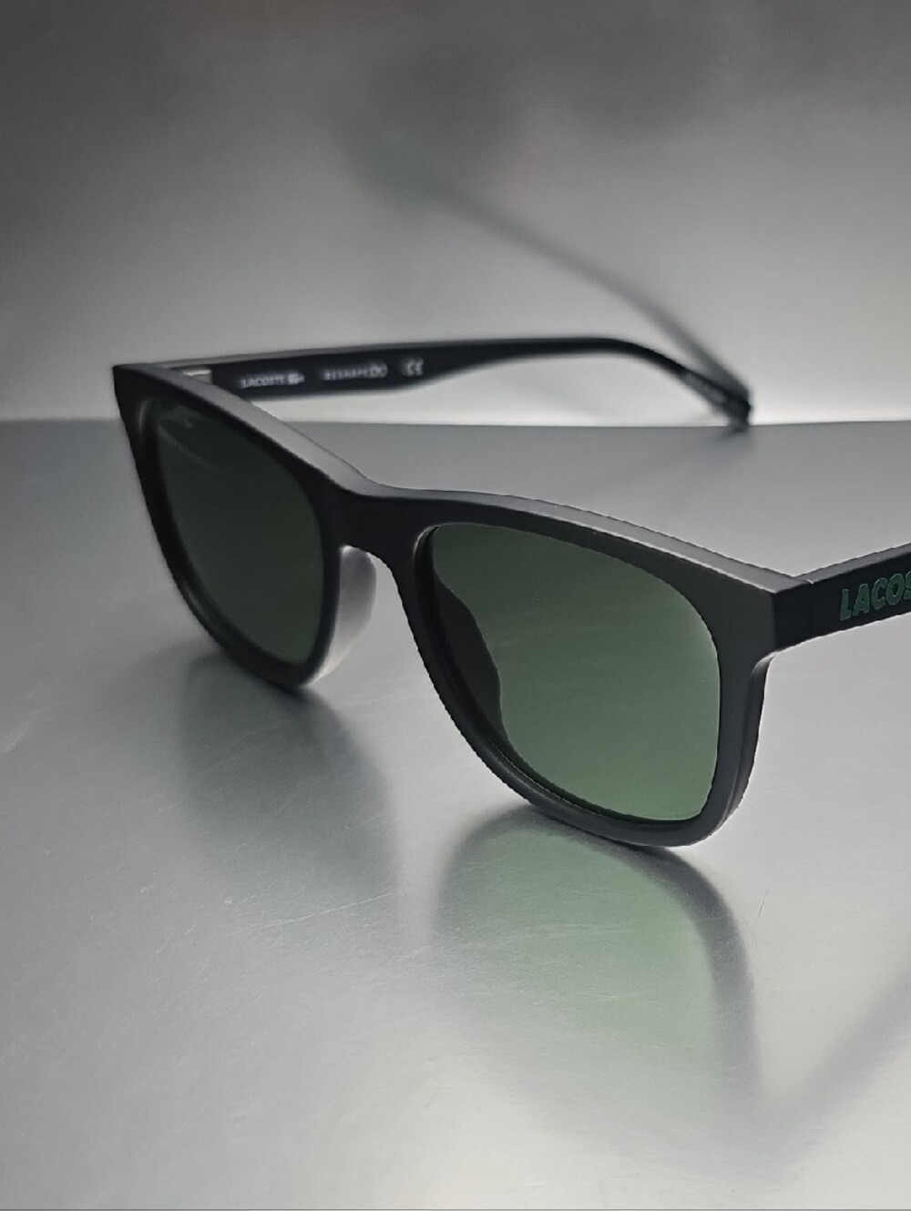 Lacoste Black Frame Sunglasses with Green Lenses